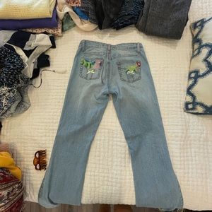 Mid rise flare Jeans with bow on back pockets